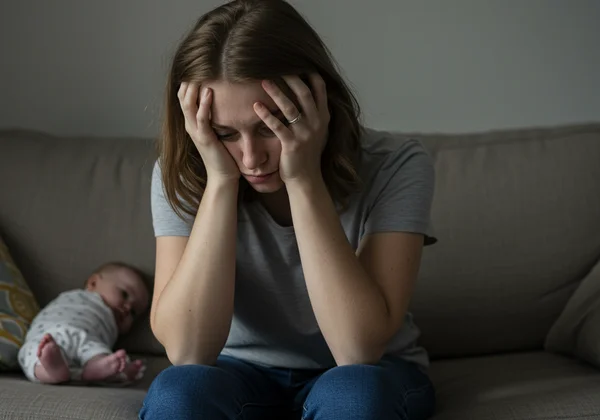 Overwhelmed new mother with persistent feelings of sadness